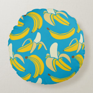Gele bananen, blauw achtergrondpatroon rond kussen