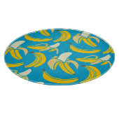 Gele bananen, blauw achtergrondpatroon snijplank (Hoek)