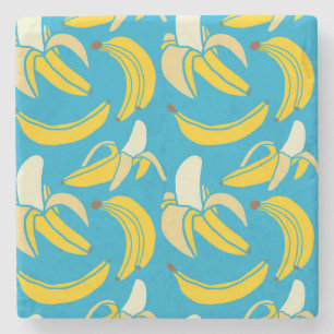Gele bananen, blauw achtergrondpatroon stenen onderzetter