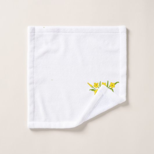 Gele bloem met groene bladeren op wit bad handdoek (Wasdoekje)