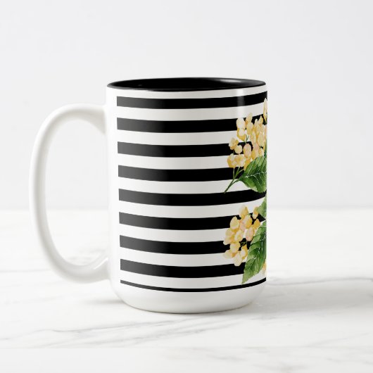 Gele bloemen op zwarte en witte strepen tweekleurige koffiemok (Links)