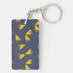 Gele, coole, unieke driehoeken met trendy sleutelhanger
