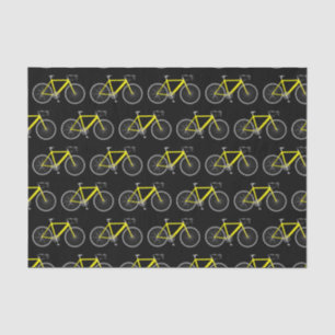 Gele fiets op zwart papier