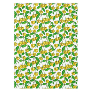 Gele kersen op wit tafelkleed