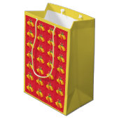 Gele kerstklokken op rode cadeautas (Achterkant Gekanteld)