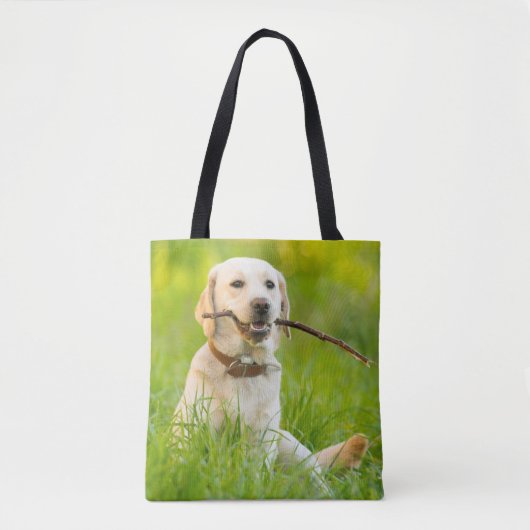 Gele labrador bespeelt zich op een stok tote bag (Voorkant)