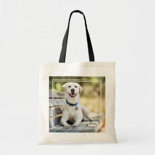 gele labrador introduceert op bank tote bag