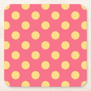 Gele polka-punten op koraal kartonnen onderzetters