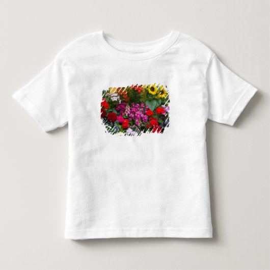 Gele schutting met bloementuin in kinder shirts (Voorkant)