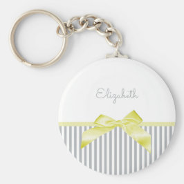Gele staafjes met meisjesgrijze strepen en naam sleutelhanger