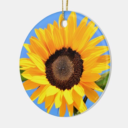 Gele zonnebloem tegen zon op blauwe hemel - zomer keramisch ornament (Links)