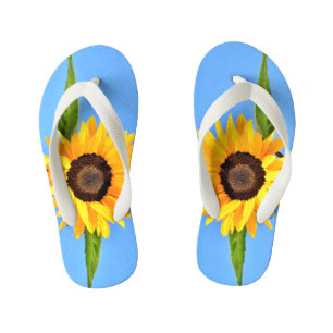 Gele zonnebloem tegen zon op blauwe hemel - zomer kinder teenslippers