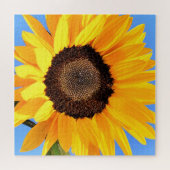 Gele zonnebloem tegen zon op blauwe hemel - zomer legpuzzel (Horizontaal)