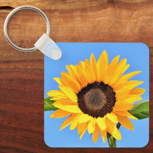 Gele zonnebloem tegen zon op blauwe hemel - zomer sleutelhanger (Voorkant)