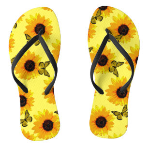 Gele zonnebloemen en vlinderdijen, waarvan de lede teenslippers
