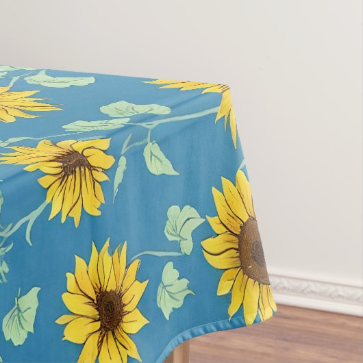Gele zonnebloemen groene bladeren blauwe achtergro tafelkleed (Voorbeeld)