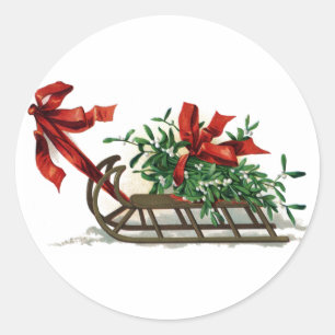 Geleid met een mistletoe in rood lintje ronde sticker