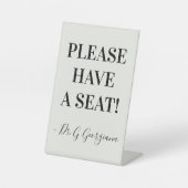 "GELIEVE EEN ZITPLAATS TE HEBBEN!" + Naam Reclamebord Met Voetstuk (Voorkant)