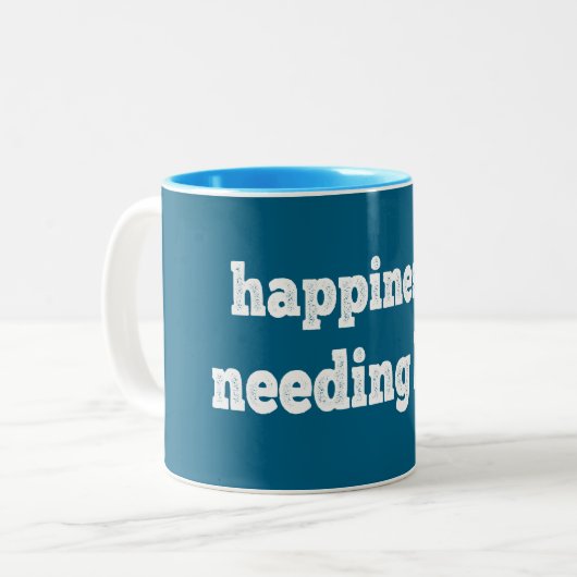 Geluk = minder nodig hebben tweekleurige koffiemok (Voorkant links)