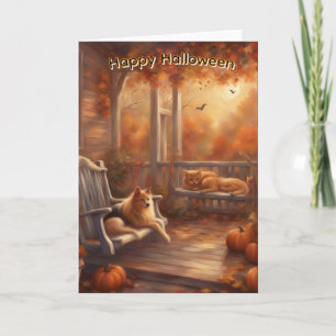 Gelukkig Halloween kat en hond op een voorportiek Kaart