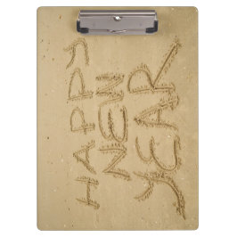 Gelukkig nieuwjaar in zand klembord