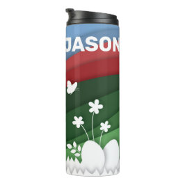 Gelukkig paasmannetje en eitjes in natuur thermosbeker