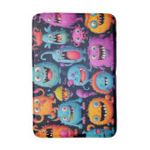 Gelukkige groep kleurrijke monsters op zwart badmat (Voorkant Verticaal)