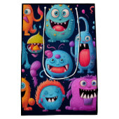 Gelukkige groep kleurrijke monsters op zwart medium cadeauzakje (Achterkant)