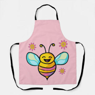 Gelukkige lachende baby bij met bloemen. schort