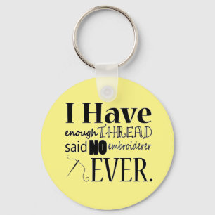 Genoeg geborduurde thread sleutelhanger