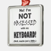Geobsedeerd toetsenbord metalen ornament (Links)