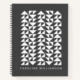 Geometrische driehoek vormt patroon in zwart notitieboek