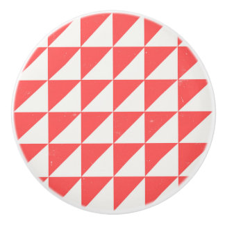 Geometrische rode en crèmekleurige driehoeken deur keramische knop