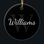 Gepersonaliseerd monogram en naam zwart keramisch ornament<br><div class="desc">De gepersonaliseerde eigenschappen van het Monogram en van de Gift van de Naam personaliseerde naam in de stijl van de witte manuscriptdoopvont en monogram in grijze serif doopvontstijl als achtergrond,  op zwarte achtergrond. Ideaal voor vakantie,  gezinshereniging en speciale gelegenheden.</div>