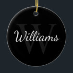 Gepersonaliseerd monogram en naam zwart keramisch ornament<br><div class="desc">De gepersonaliseerde eigenschappen van het Monogram en van de Gift van de Naam personaliseerde naam in de stijl van de witte manuscriptdoopvont en monogram in grijze serif doopvontstijl als achtergrond,  op zwarte achtergrond. Ideaal voor vakantie,  gezinshereniging en speciale gelegenheden.</div>