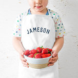 Gepersonaliseerde naam monogram | Marineblauw Kinder Schort<br><div class="desc">Deze gepersonaliseerde kinderen schorten zijn voorzien van de naam van uw kind in een modern gebogen lettertype, waardoor ze ideaal zijn voor jonge chef-koks die helpen in de keuken, creatief aankleedspel of als artiestensmocks om kleding te beschermen tijdens het knutselen. Deze schorten zijn gemaakt van een duurzame, gemakkelijk te reinigen...</div>