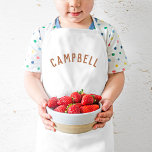 Gepersonaliseerde naam monogram | Rust Kinder Schort<br><div class="desc">Deze gepersonaliseerde kinderen schorten zijn voorzien van de naam van uw kind in een modern gebogen lettertype, waardoor ze ideaal zijn voor jonge chef-koks die helpen in de keuken, creatief aankleedspel of als artiestensmocks om kleding te beschermen tijdens het knutselen. Deze schorten zijn gemaakt van een duurzame, gemakkelijk te reinigen...</div>