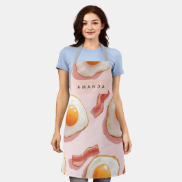 Gepersonaliseerde roze gebakken eieren en spek pat schort