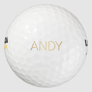 Gepersonaliseerde Stencil Font Andy Gold op zwart Golfballen