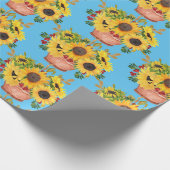 Gepootte zonnebloemen op blauw cadeaupapier (Hoek)
