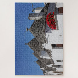 Geraniumbloemen en boomgaarden in Alberobello Legpuzzel