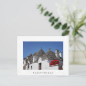 Geraniumbloemen en driehoekshuizen in Alberobello Briefkaart (Staand voorkant)
