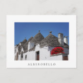 Geraniumbloemen en driehoekshuizen in Alberobello Briefkaart (Voorkant)