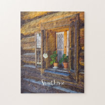 Geraniumbloemen op het raam