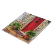 Geraniums door de rode deur tegeltje (Zijkant)