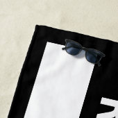 GERESERVEERDE, witte tekst op zwarte streep met ra Strandlaken (In situ)