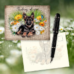 German Shepherd Dog in Wildflowers Custom Postcard Briefkaart<br><div class="desc">Thinking of you, German Shepherd dog postcard. White daisies, yellow calendula, palmetto palm fronds and a blue butterfly surround a sweet pup lying in a bed of flowers. Background image is dark linen fabric (design only) with black script along the top that is easy to change to your choice of...</div>