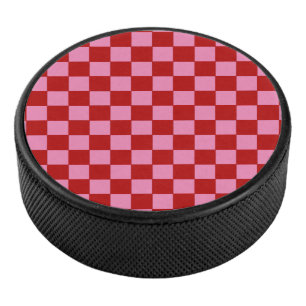 Geruit rood en heet roze hockey puck