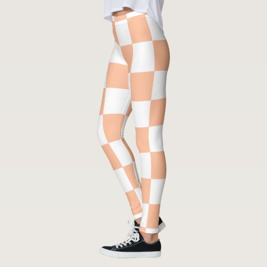 Geruite vierkanten perzik en witte geometrische re leggings (Links)
