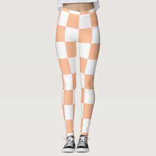 Geruite vierkanten perzik en witte geometrische re leggings